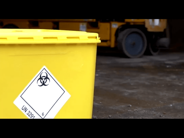 A closeup of a toxic waste bin