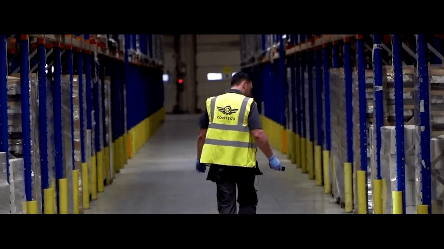 A technician inspecting a facility for pests