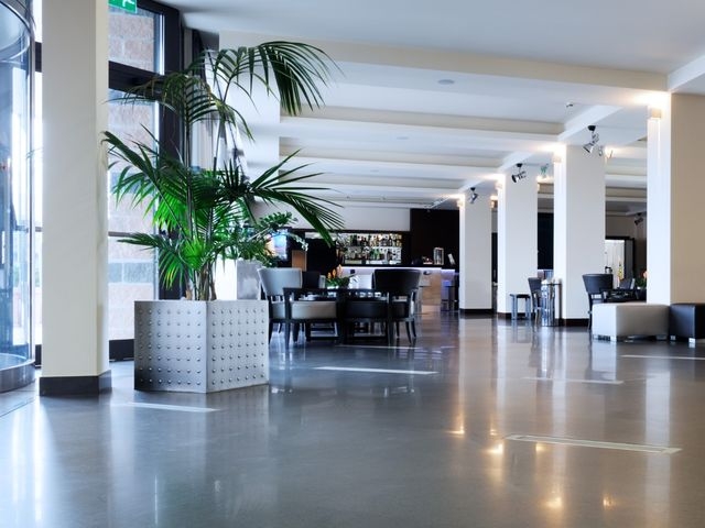 A empty hotel reception and dining area 